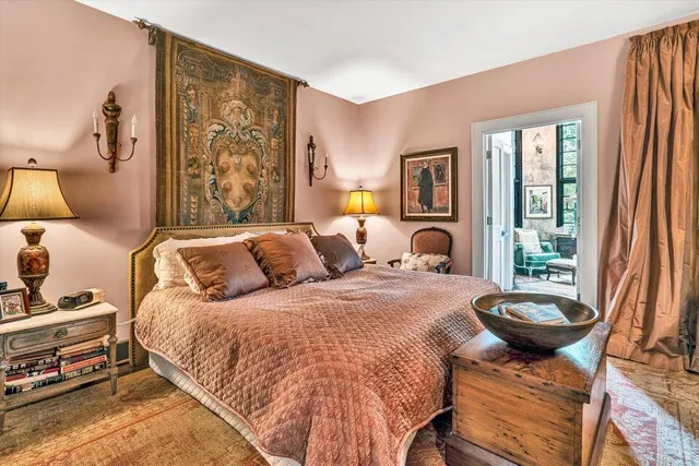 a view of a big yard with plants and large trees