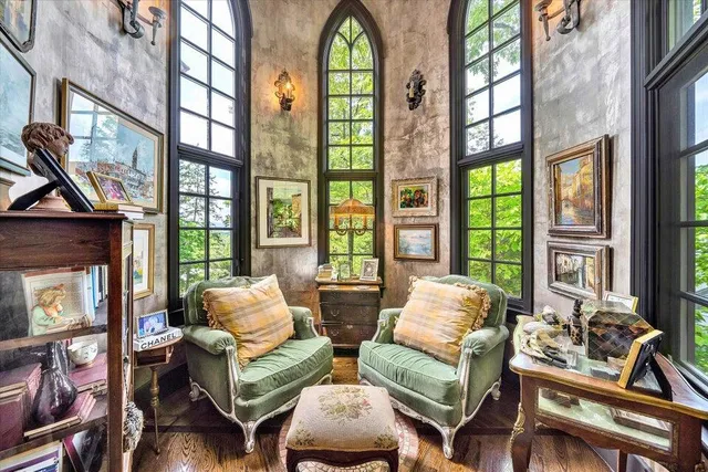 an aerial view of residential houses with outdoor space and trees