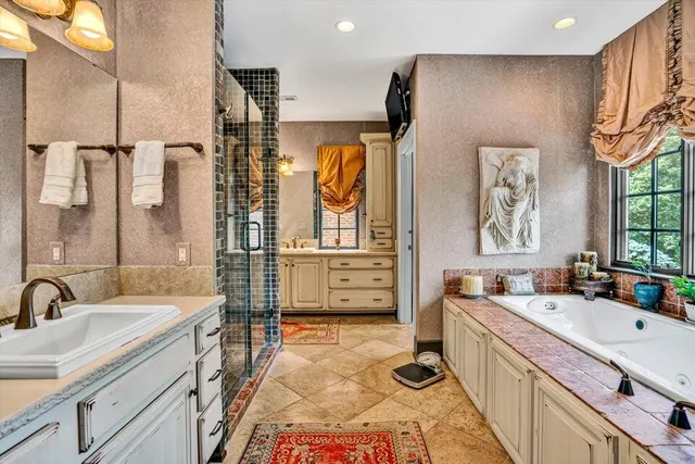 a view of a field of grass and trees