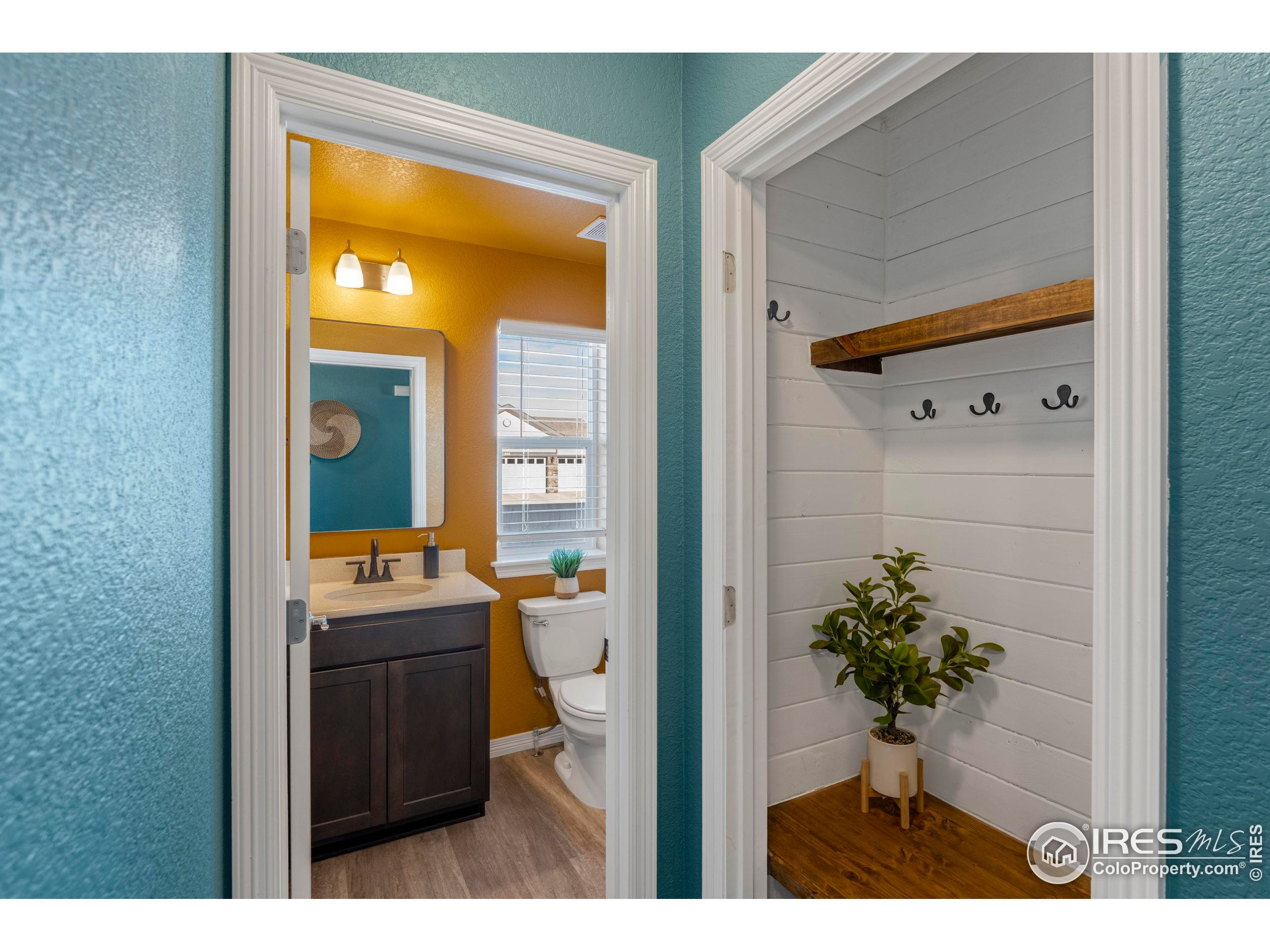 4527 Longmead Drive Windsor, CO 80550 - Photo 11 of 32 a bathroom with a sink and mirror