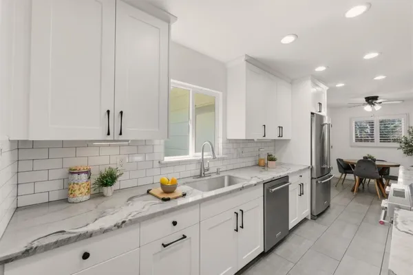 a kitchen with a sink and cabinets