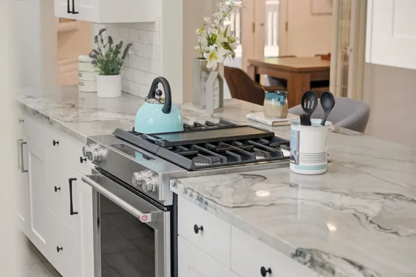 a dining room with a table and chairs