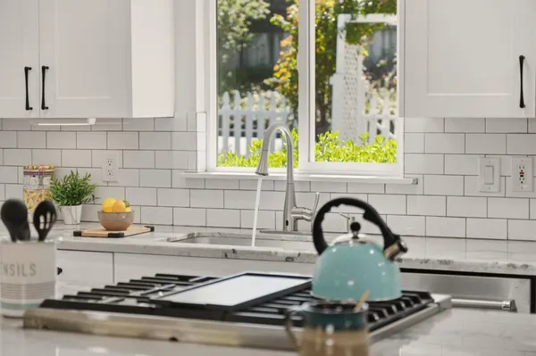 a view of a dining room with furniture and window