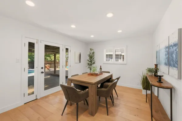 a dining room with furniture and window