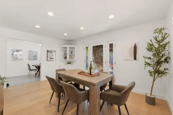 a view of a workspace with a table and chair in a room