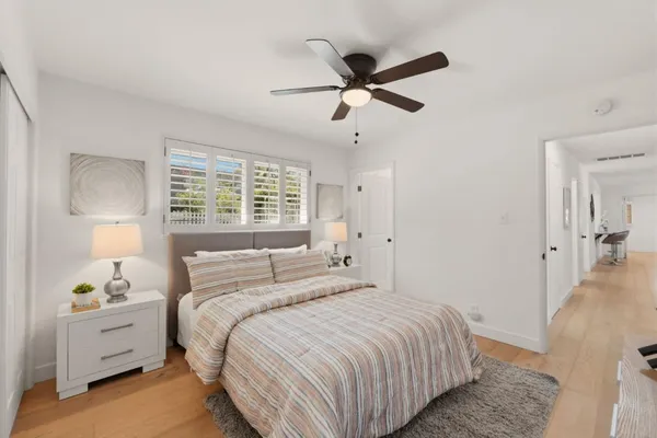 a bedroom with a bed and a window