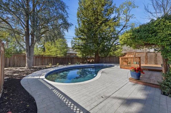 a view of a chair and tables in the patio