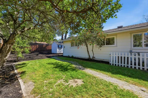 an aerial view of a house with a garden