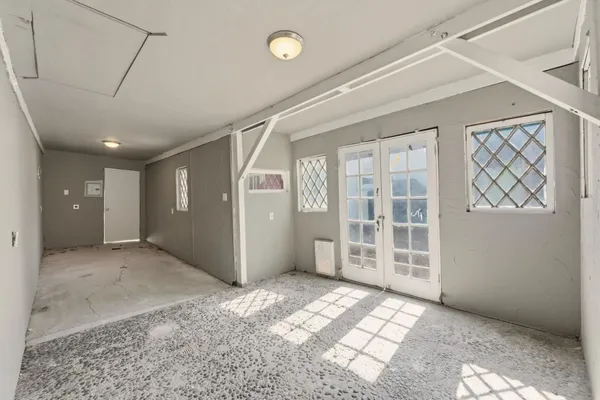 an aerial view of a residential houses with outdoor space
