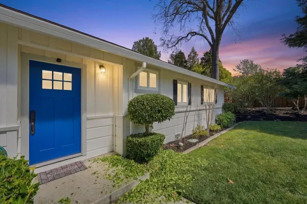 a view of a house with a garden