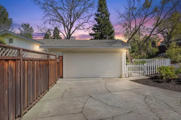 a front view of a house having garage