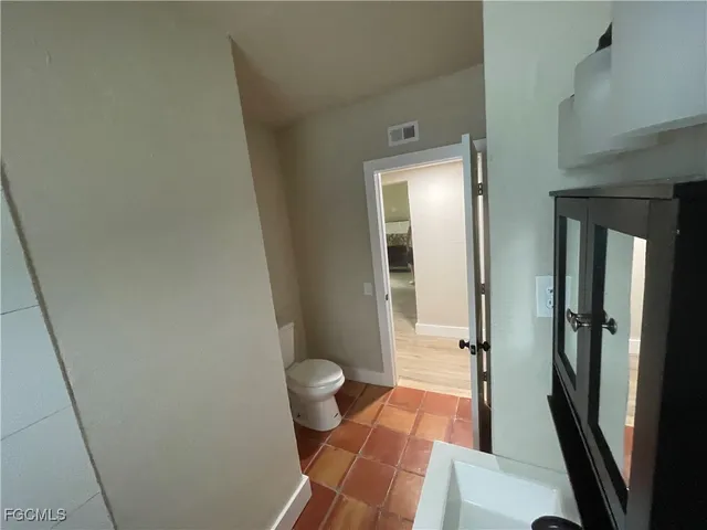 a bathroom with a tub a sink and a shower