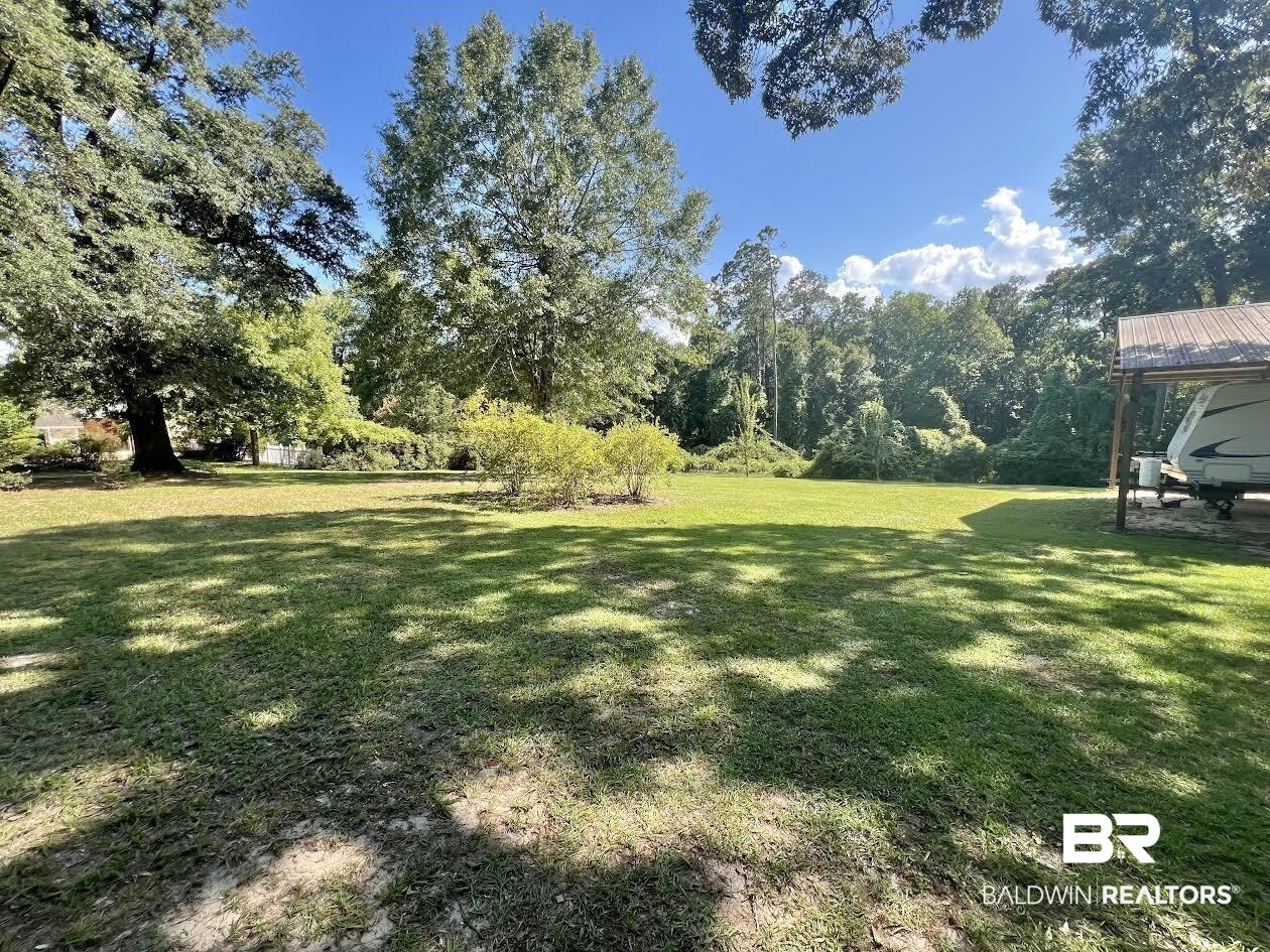 2691 Appleton Road Brewton, AL 36426 - Photo 59 of 60 View of green lawn with a patio