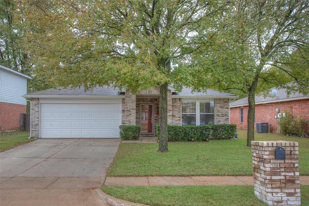1208 Rambling Brook Trail Denton, TX 76210 - Photo 1 of 1 a front view of a house with garden