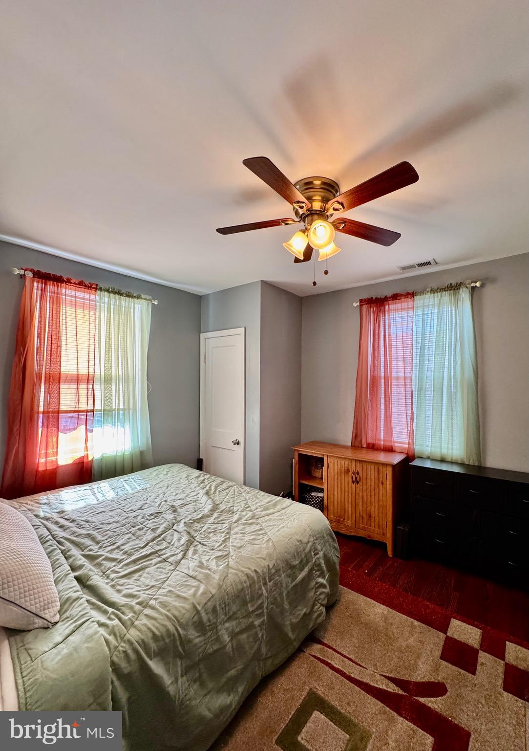 1519 Northgate Road Baltimore, MD 21218 - Photo 19 of 34 a bedroom with a large bed and a large window