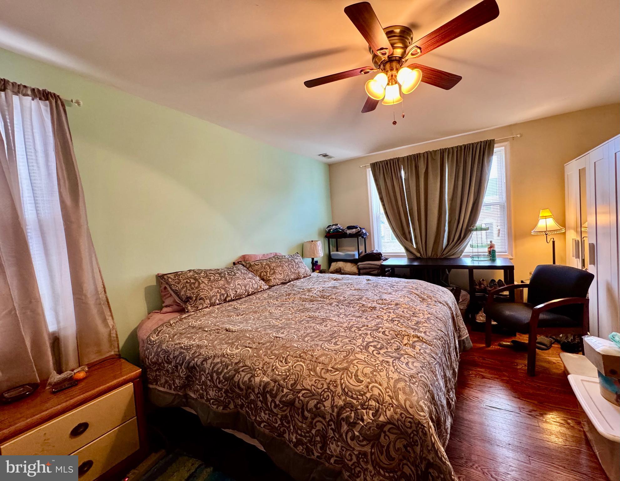 1519 Northgate Road Baltimore, MD 21218 - Photo 20 of 34 a bedroom with a bed and wooden floor