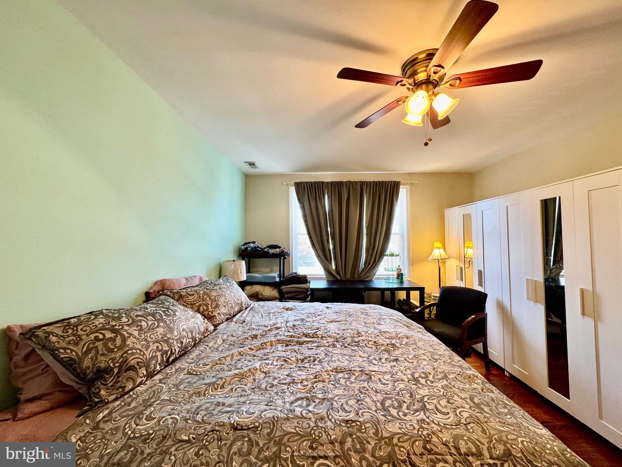 1519 Northgate Road Baltimore, MD 21218 - Photo 23 of 34 a bedroom with a bed and a chandelier