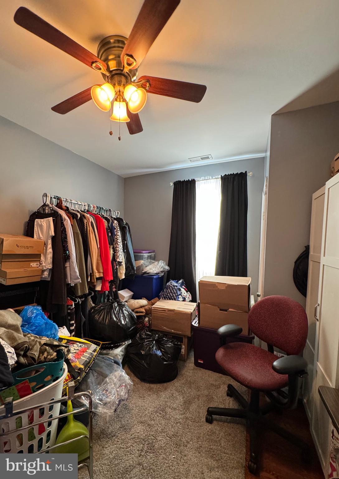 1519 Northgate Road Baltimore, MD 21218 - Photo 25 of 34 a living room with lots of furniture and a chandelier