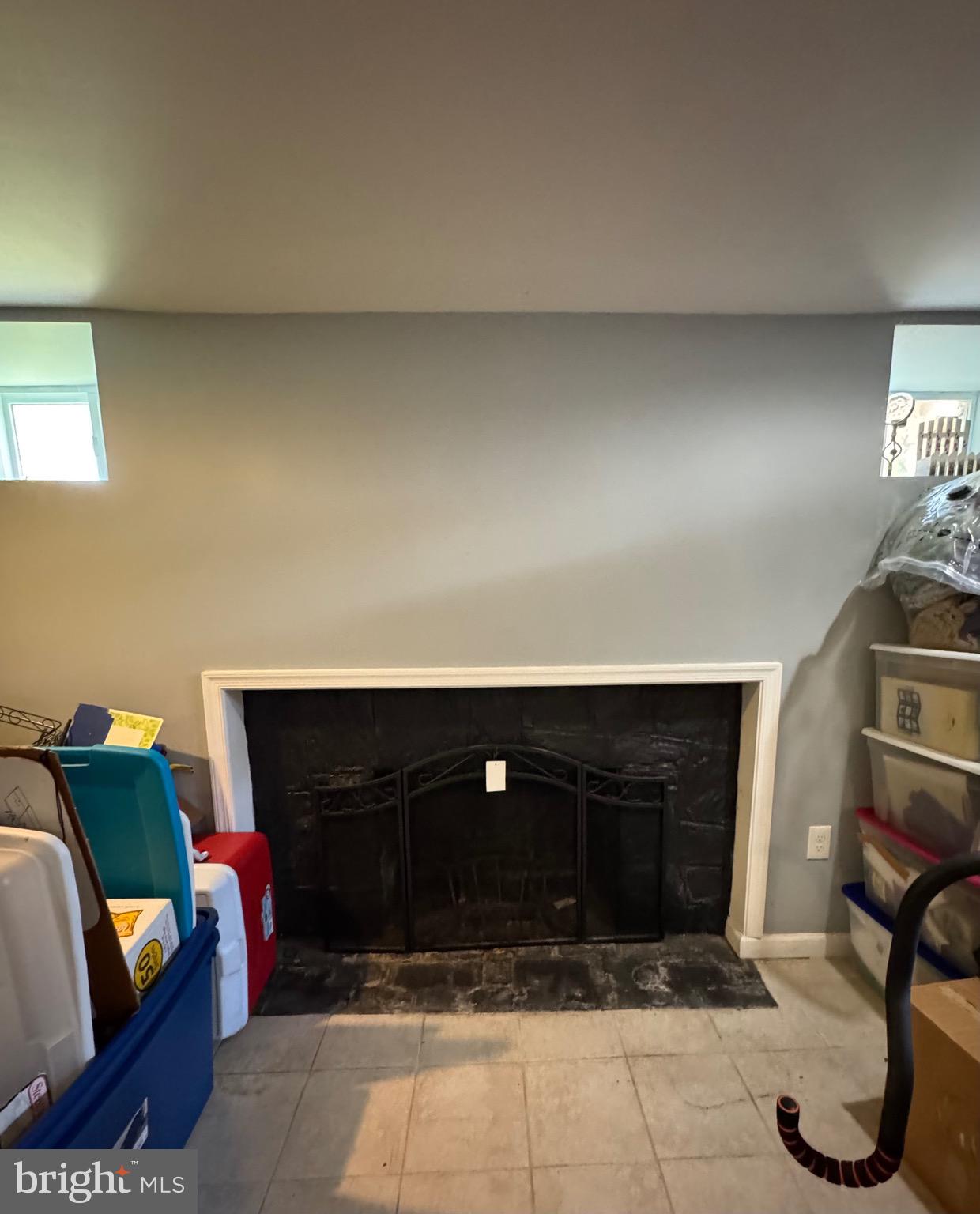 1519 Northgate Road Baltimore, MD 21218 - Photo 31 of 34 a living room with furniture and a fireplace