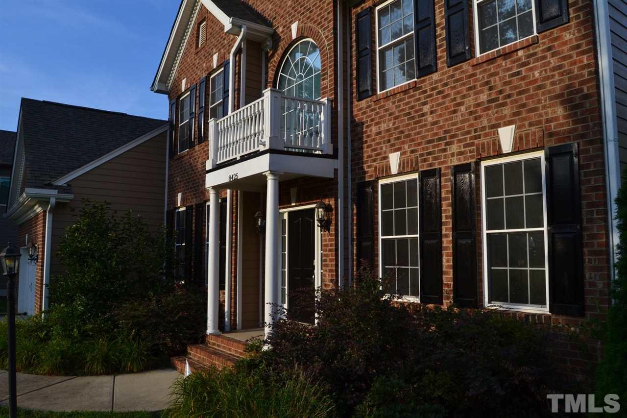 8425 Henderson Road Apex, NC 27539 - Photo 2 of 25 a view of a house with a yard