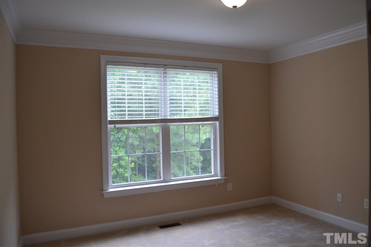 8425 Henderson Road Apex, NC 27539 - Photo 17 of 25 a view of an empty room with a window
