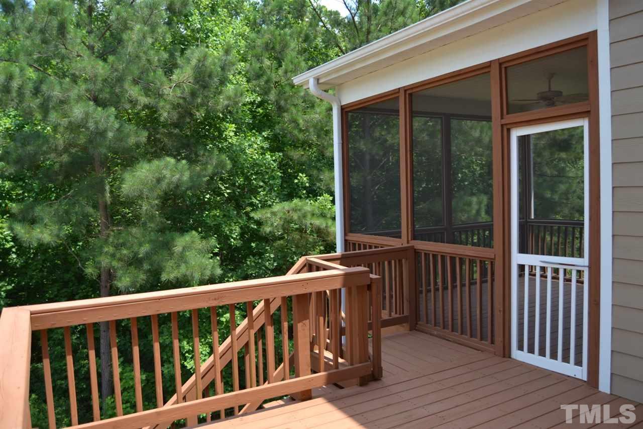 8425 Henderson Road Apex, NC 27539 - Photo 18 of 25 a balcony with wooden floor and outdoor space