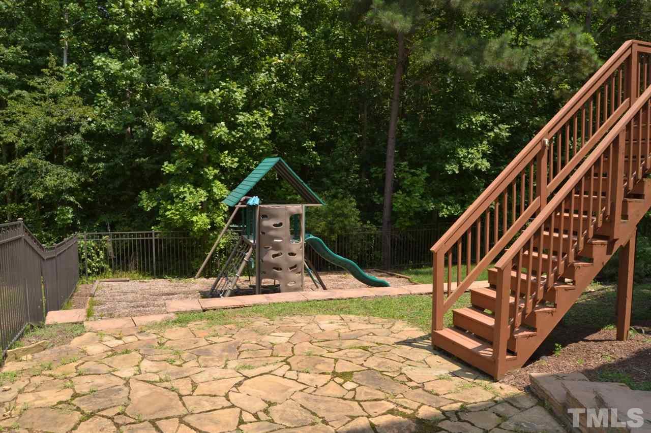 8425 Henderson Road Apex, NC 27539 - Photo 19 of 25 a view of outdoor space with seating and trees