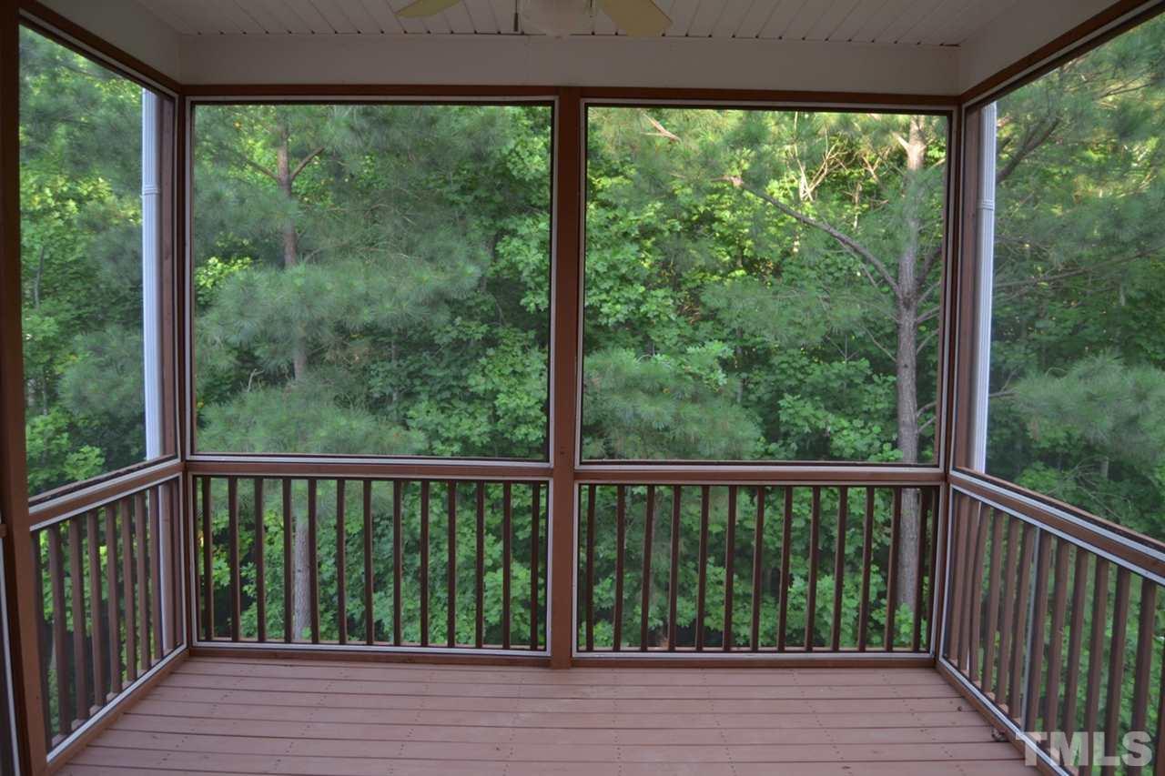 8425 Henderson Road Apex, NC 27539 - Photo 20 of 25 a view of a balcony with wooden floor