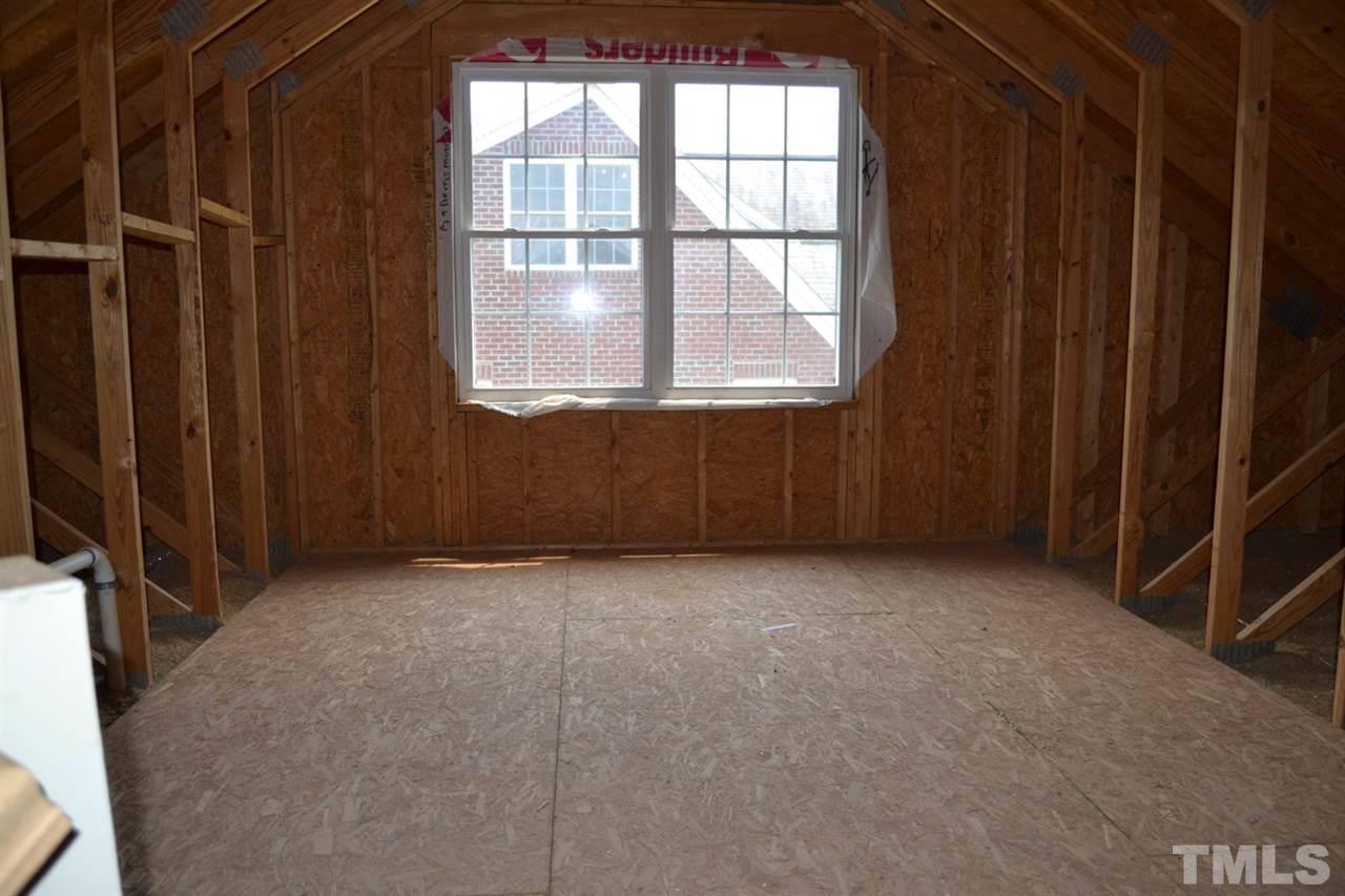8425 Henderson Road Apex, NC 27539 - Photo 23 of 25 an empty room with windows