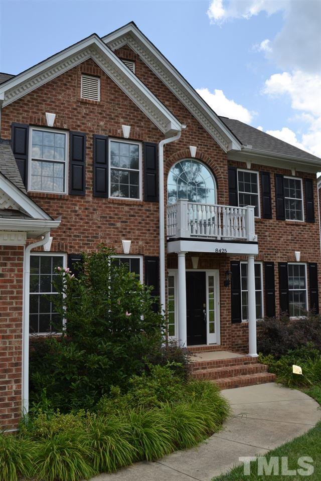 8425 Henderson Road Apex, NC 27539 - Photo 25 of 25 a front view of a house with garden