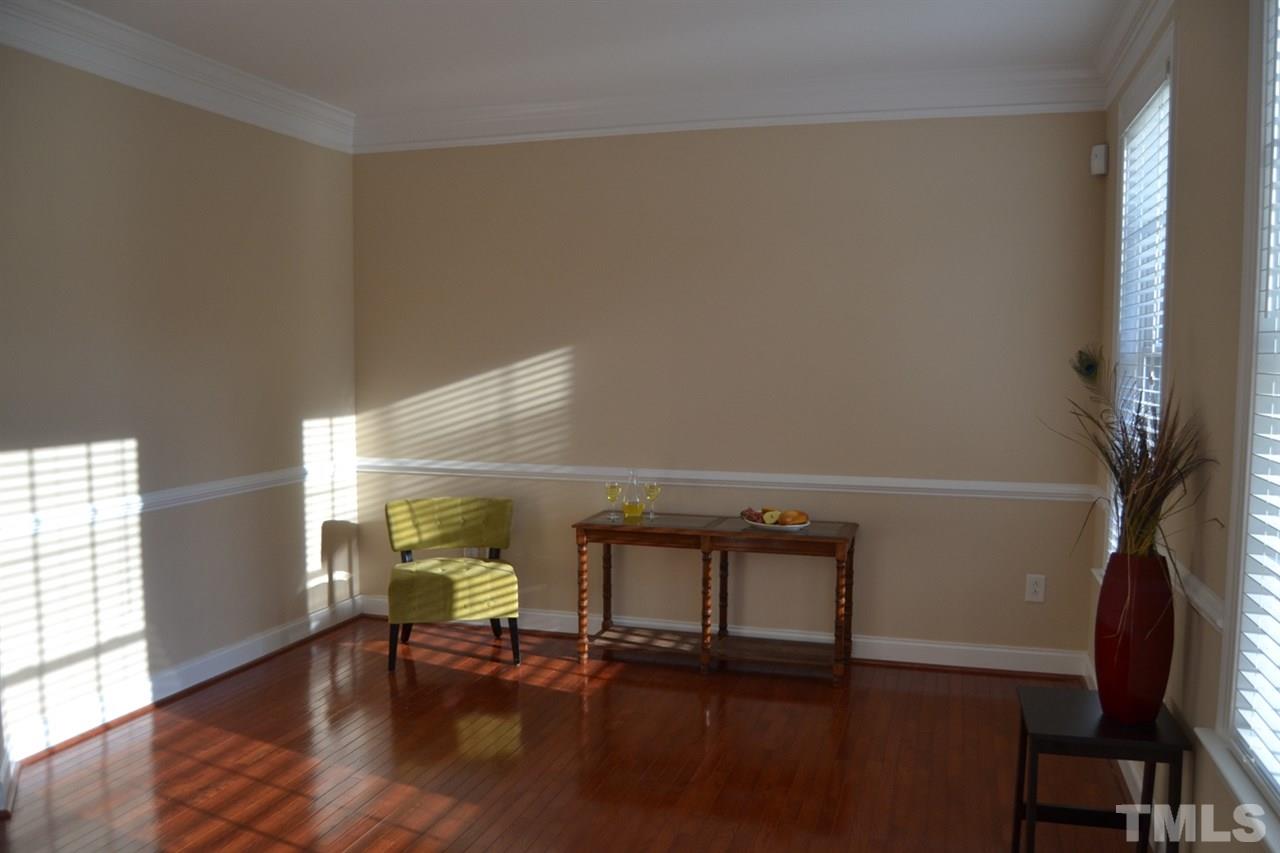 8425 Henderson Road Apex, NC 27539 - Photo 8 of 25 a view of livingroom with furniture and wooden floor