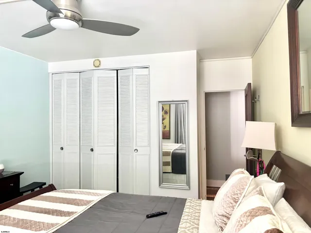 a bedroom with a bed and a lamp