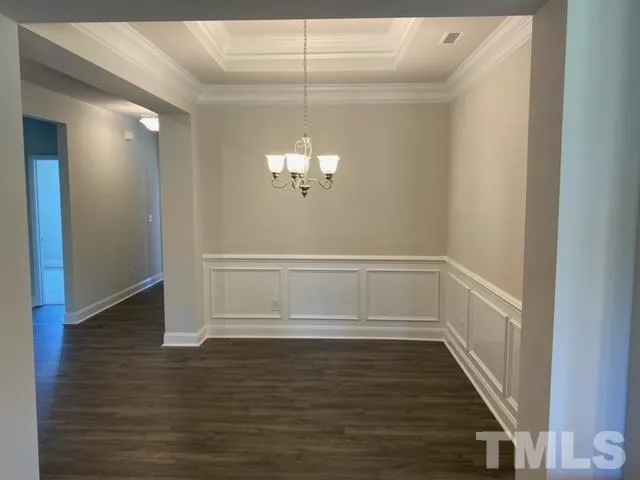 a kitchen with kitchen island granite countertop a sink cabinets and stainless steel appliances
