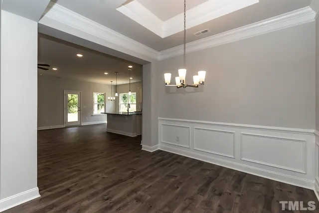 a kitchen with stainless steel appliances granite countertop a sink refrigerator and microwave