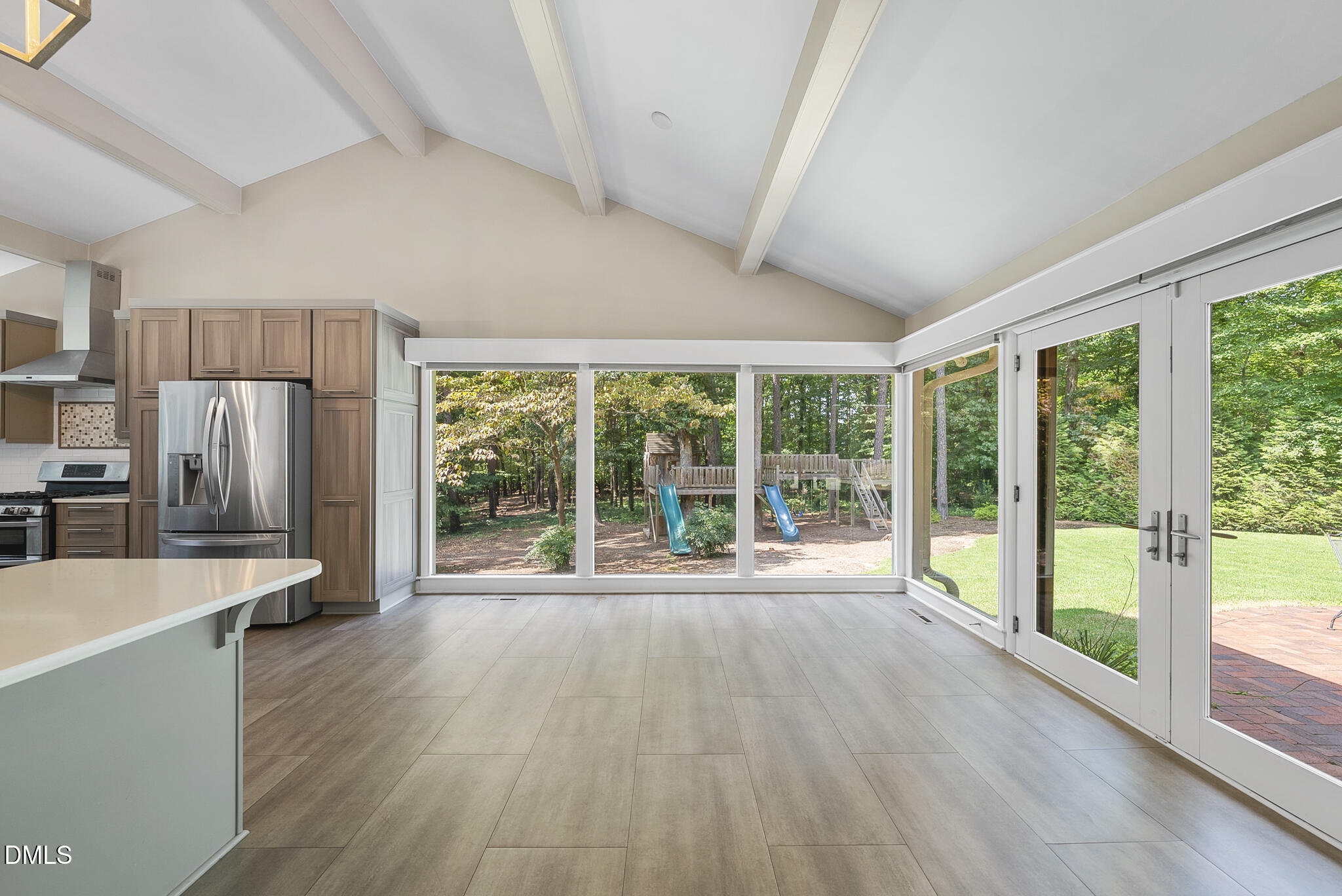 1605 Ridge Road Raleigh, NC 27607 - Photo 18 of 34 a view of a kitchen with large windows and refrigerator