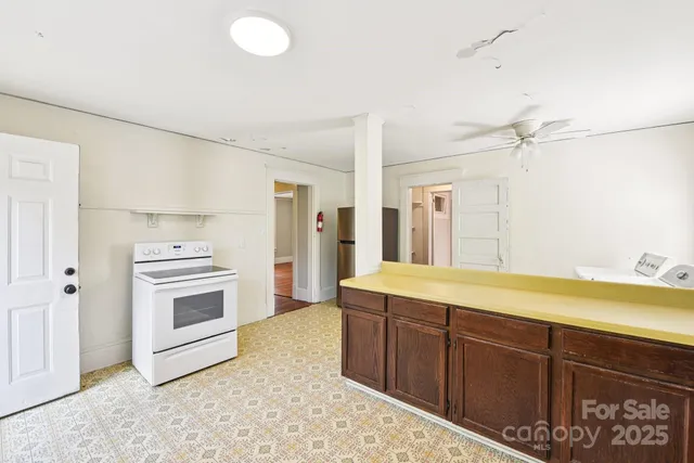 a spacious bathroom with a sink a vanity and a mirror