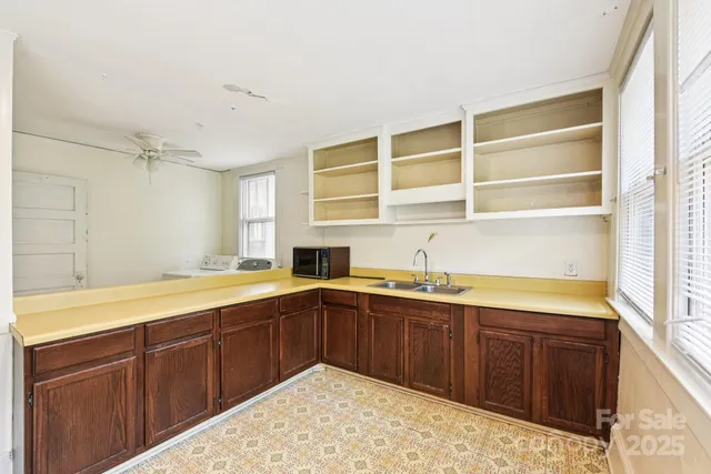a kitchen with a sink and cabinets