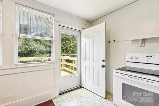 a view of kitchen with furniture and window