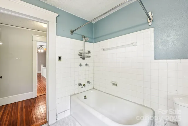 a bathroom with a bathtub and a shower