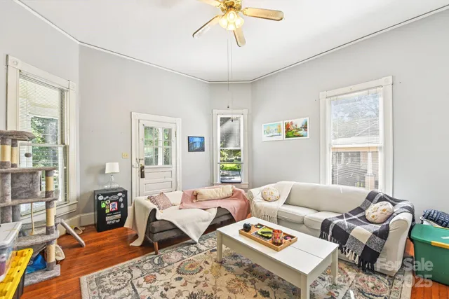 a living room with furniture a table and a window