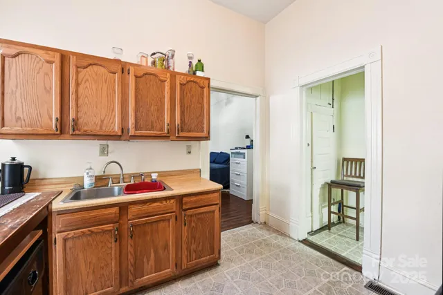 a kitchen with stainless steel appliances granite countertop a sink cabinets and granite countertops