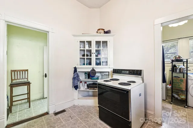 a kitchen with stainless steel appliances granite countertop a stove and a refrigerator