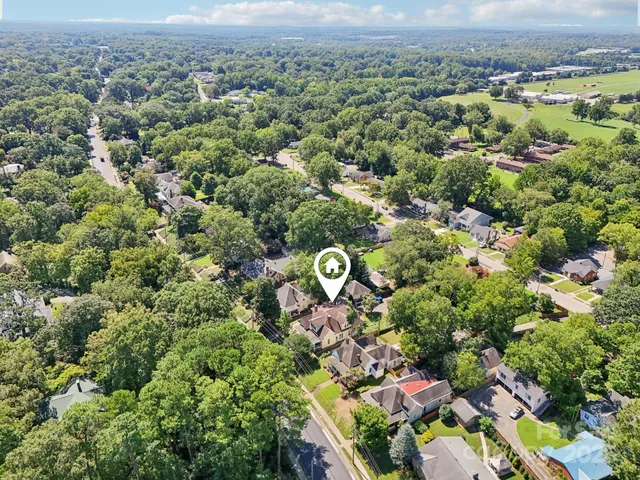 an aerial view of multiple house with yard