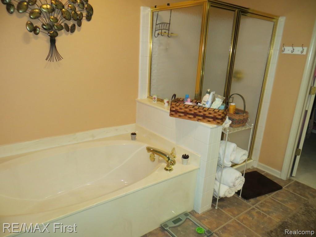 1341 Copper Circle, Unit 33 Rochester, MI 48306 - Photo 18 of 37 Master bath with deep soaking tub and stand up shower