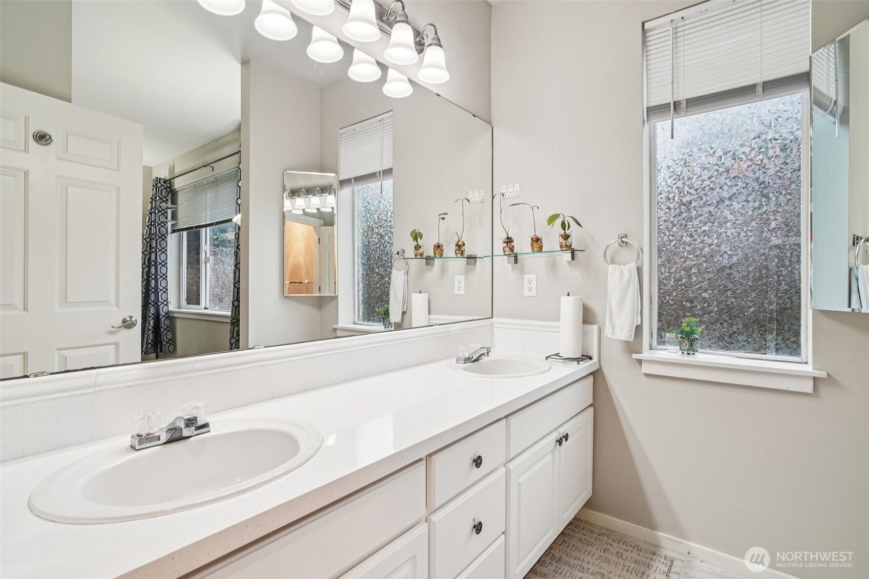 2009 196th Street Southeast, Unit C103 Bothell, WA 98012 - Photo 17 of 30 a bathroom with a sink double vanity granite and a mirror