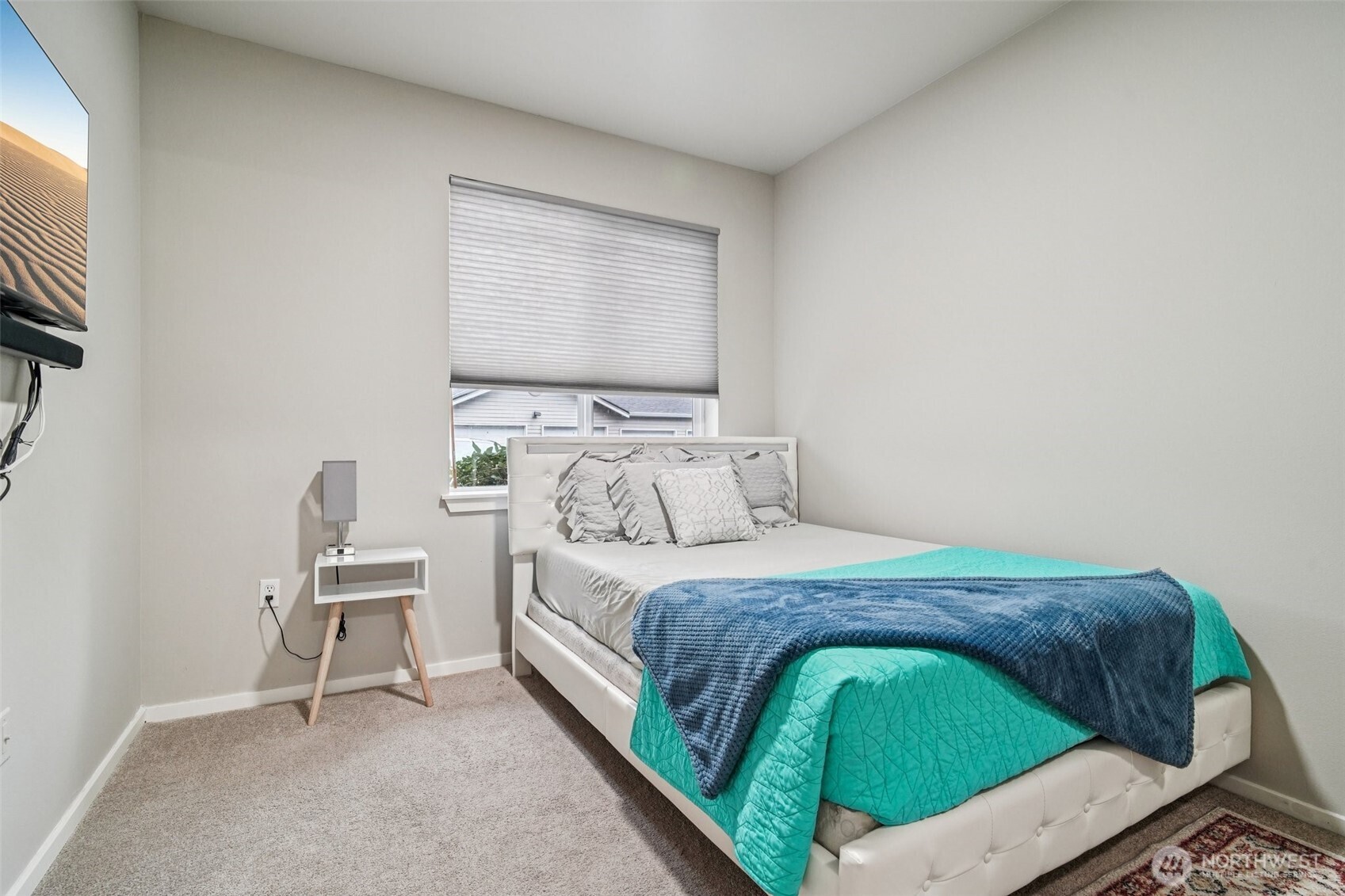 2009 196th Street Southeast, Unit C103 Bothell, WA 98012 - Photo 20 of 30 a bedroom with a bed and a chair