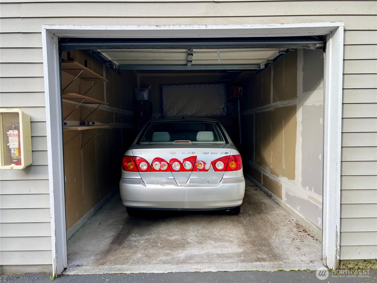 2009 196th Street Southeast, Unit C103 Bothell, WA 98012 - Photo 30 of 30 a car is parked in a garage