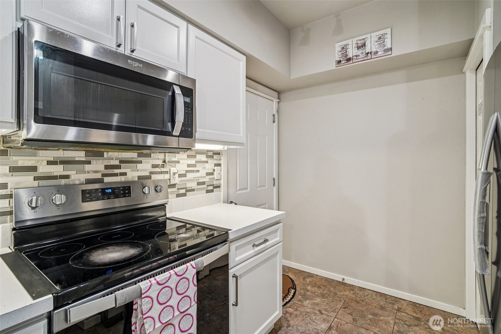 2009 196th Street Southeast, Unit C103 Bothell, WA 98012 - Photo 10 of 30 a kitchen with a stove and a microwave
