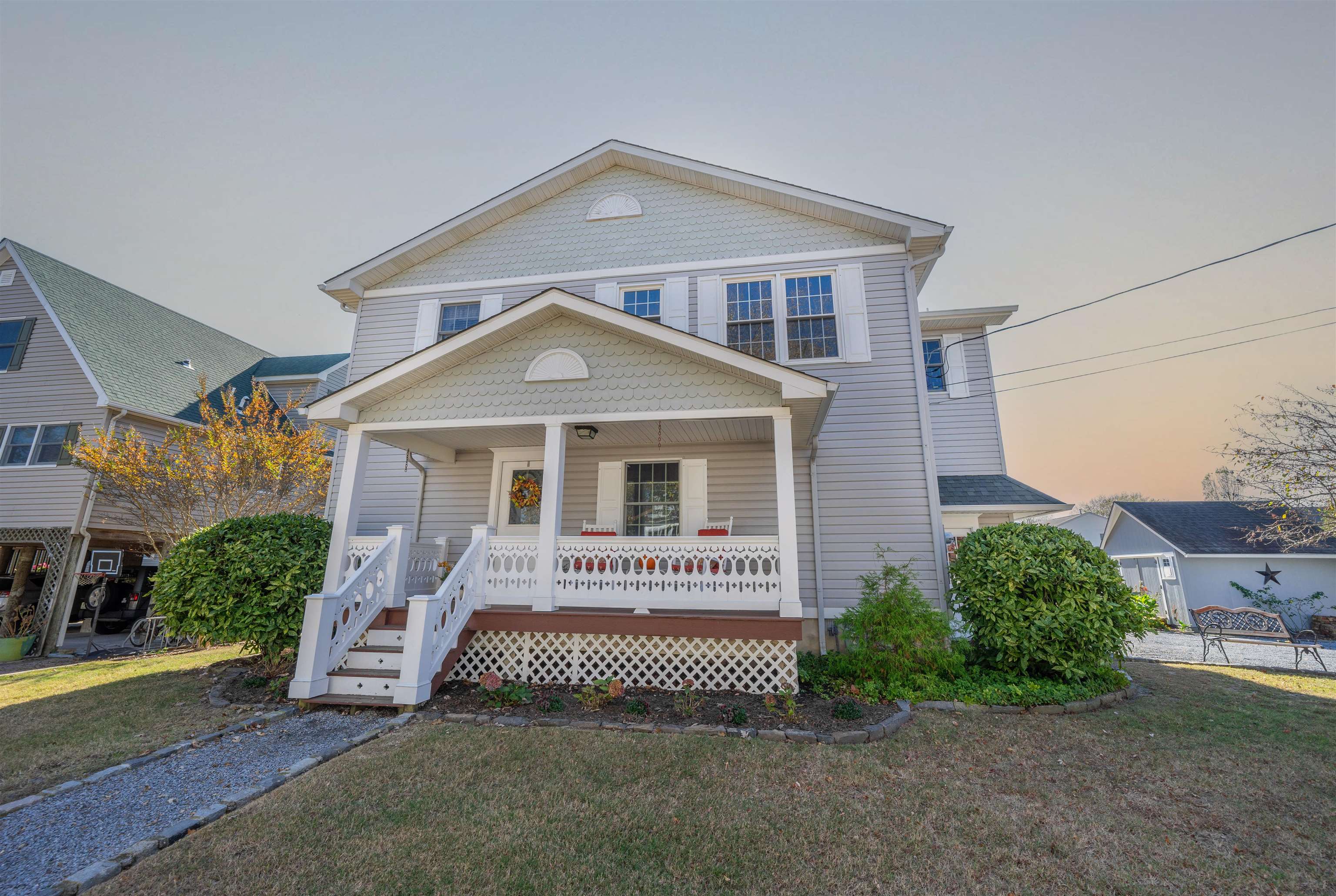 210 3rd West Cape Cape May, NJ 08204 - Photo 2 of 31 a front view of a house with a garden
