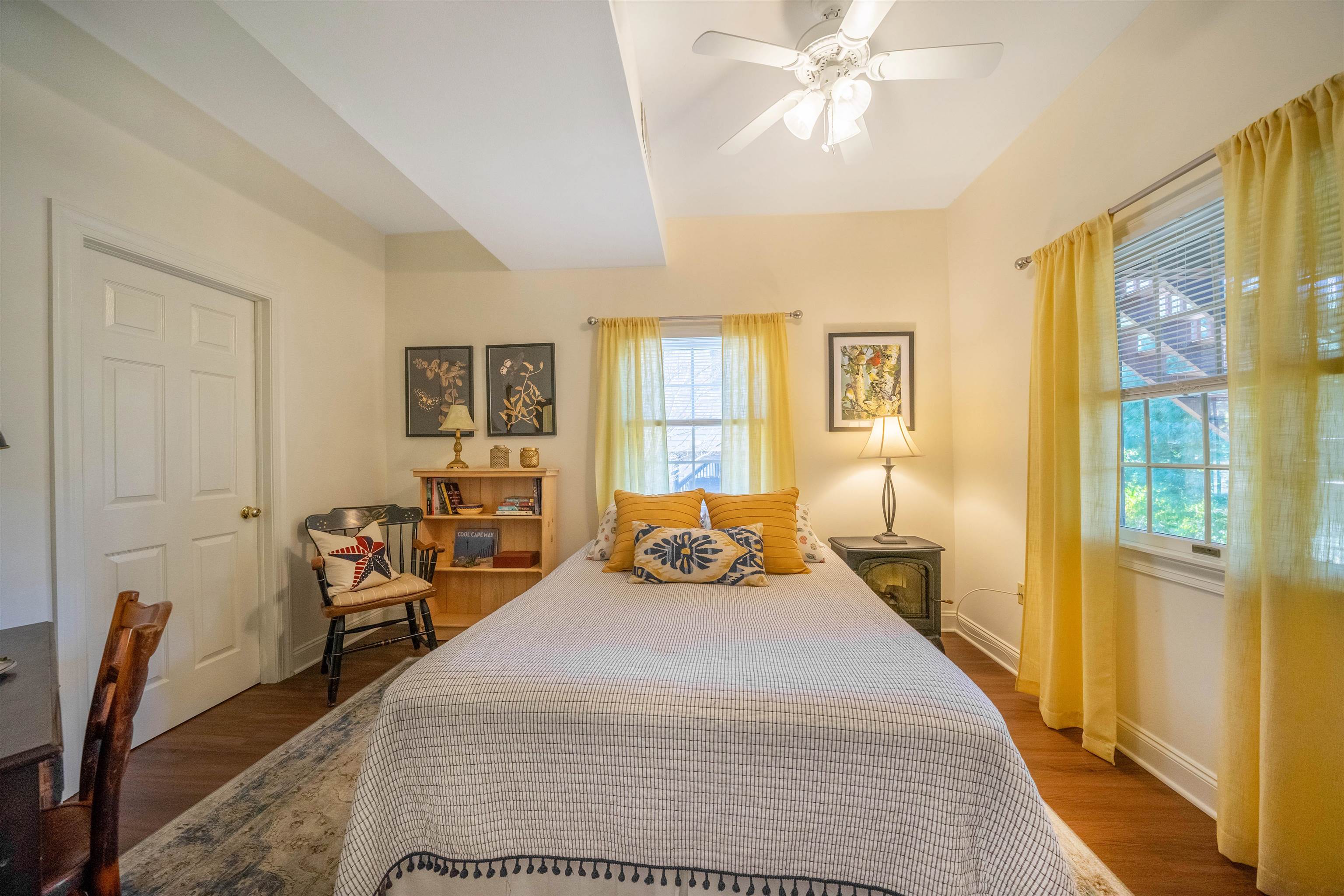 210 3rd West Cape Cape May, NJ 08204 - Photo 21 of 31 a bedroom with a bed and wooden floor